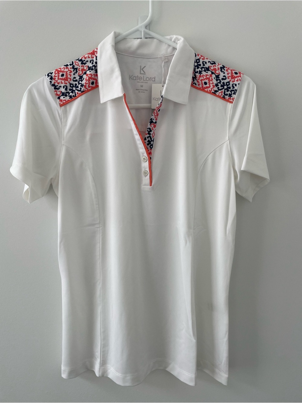 Kate Lord White Polo Top with Coral & Navy Patterned Shoulders & back panel.